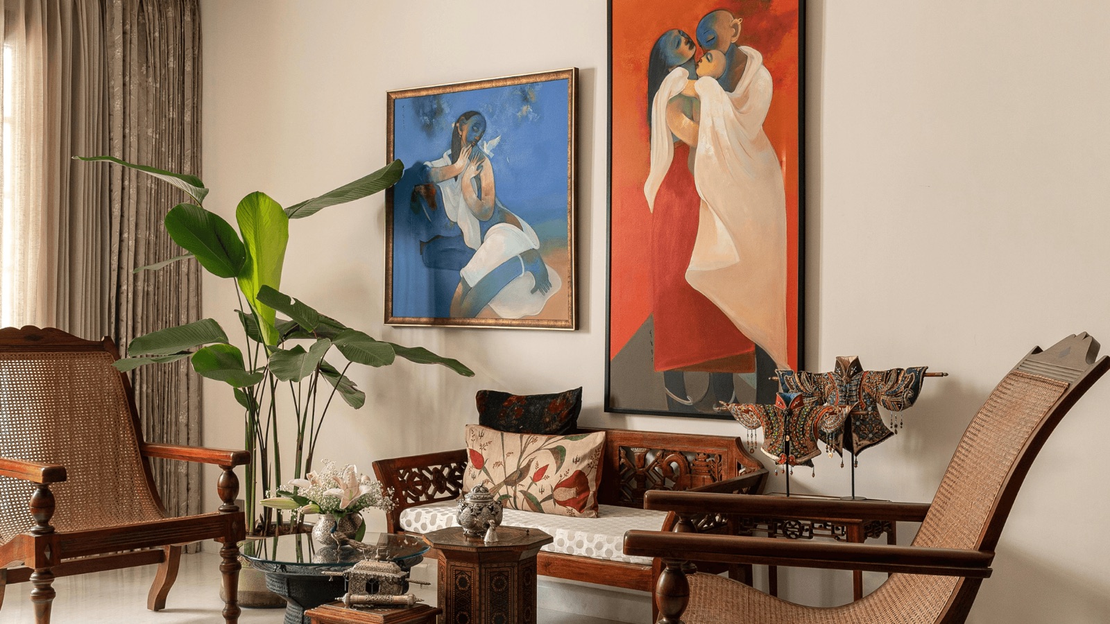 Living room with a gallery wall of art in a Bengaluru residence executed by Construction Associates, featured in the AD PRO Directory